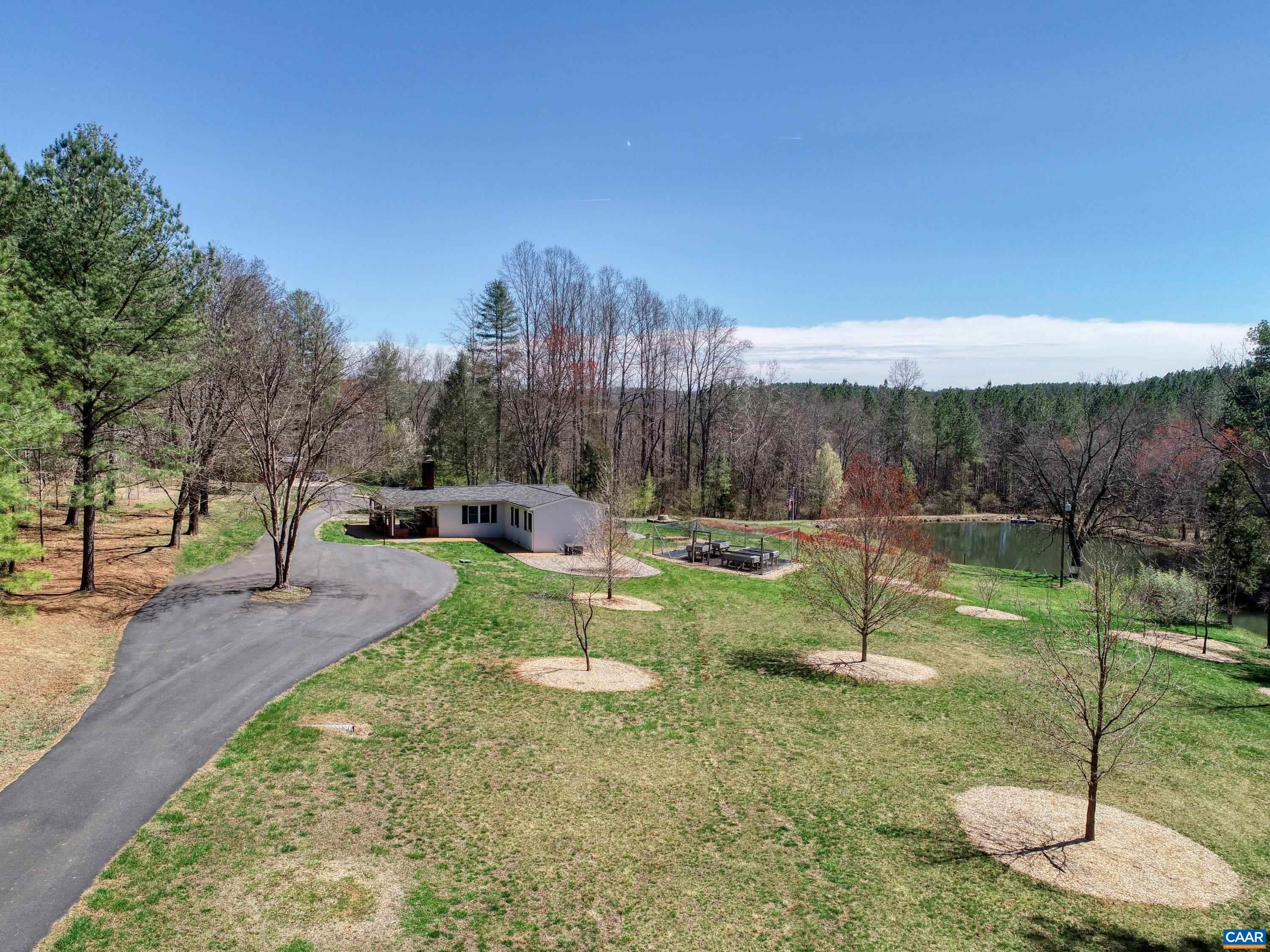 6859 Celt Road Stanardsville, VA 22973 - Photo 16 of 63 a view of a garden with large trees