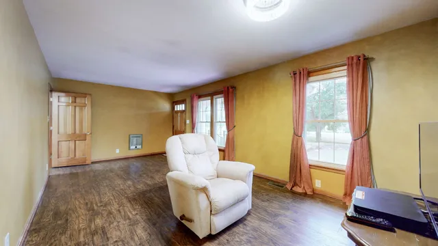 a bedroom with a bed and a night stand