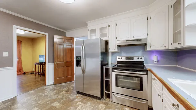 a view of an entryway with wooden floor