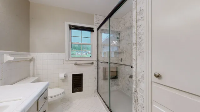 a view of an house with backyard space and garden