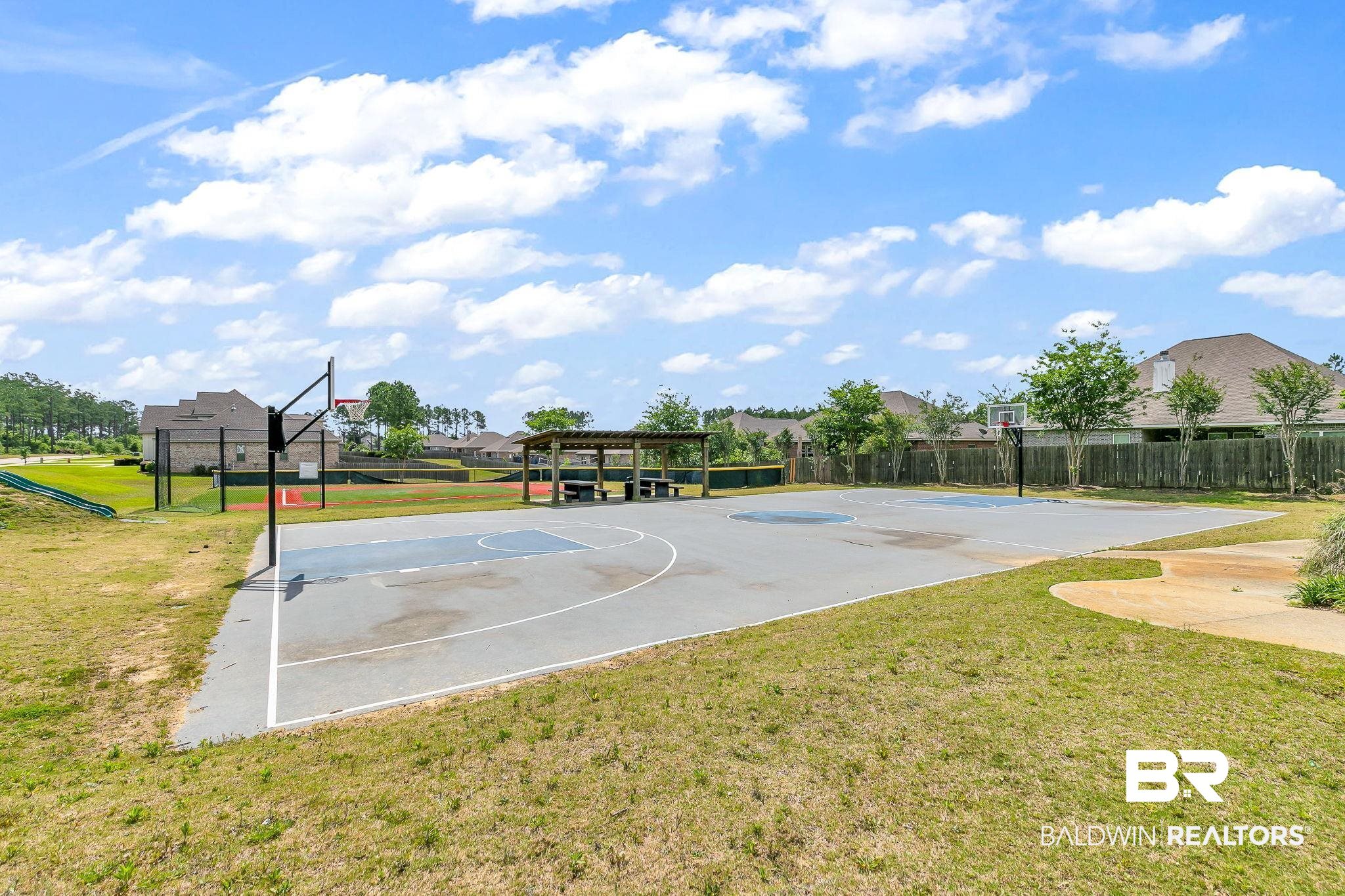 13233 Ibis Boulevard Daphne, AL 36527 - Photo 90 of 100 Outdoor basketball court featuring multiple hoops, painted court lines, and a covered picnic area