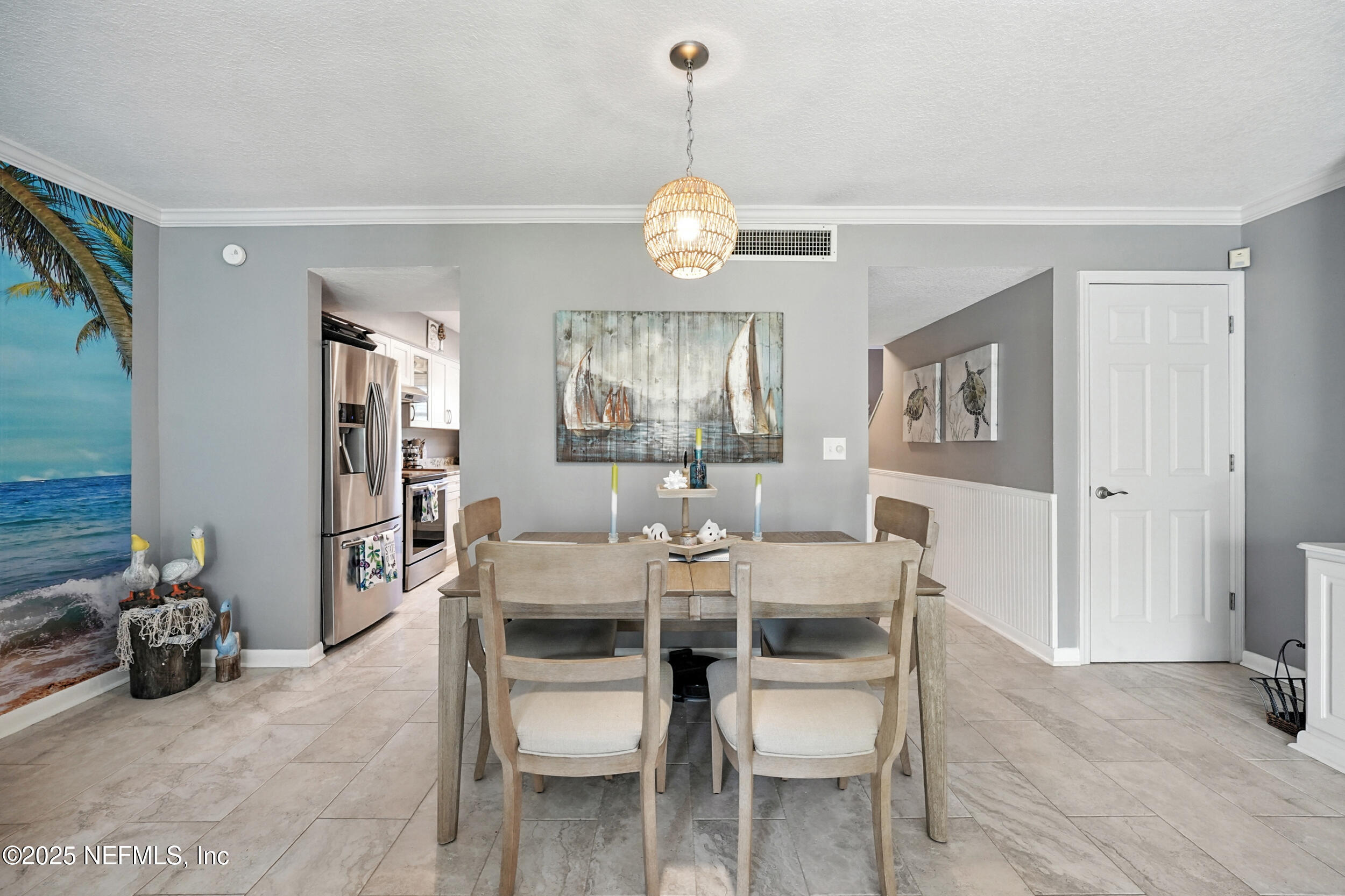 2233 Seminole Road, Unit 3 Atlantic Beach, FL 32233 - Photo 11 of 59 a view of a dining room with furniture wooden floor and a chandelier
