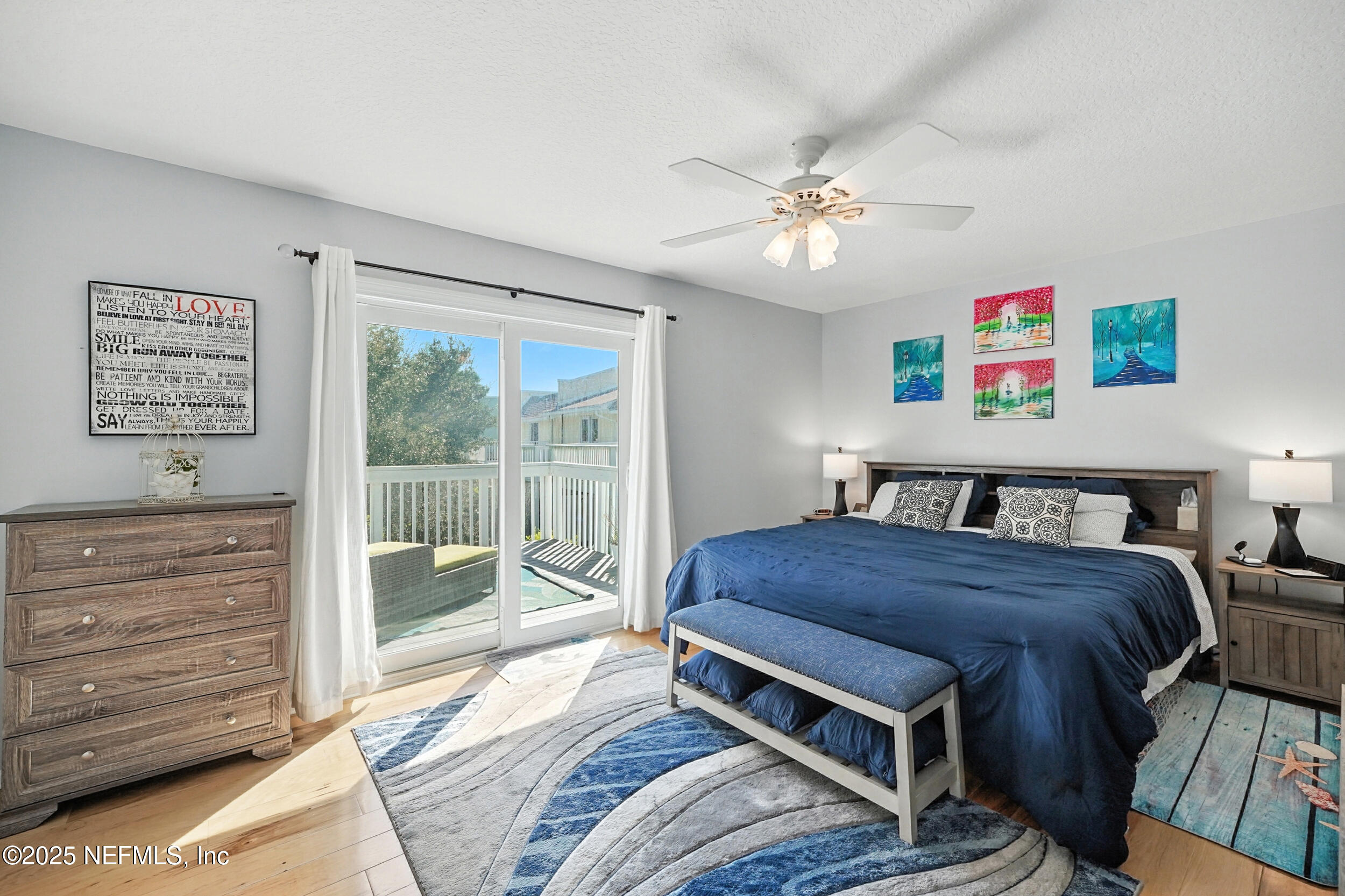 2233 Seminole Road, Unit 3 Atlantic Beach, FL 32233 - Photo 28 of 59 a bedroom with a bed dresser and wooden floor