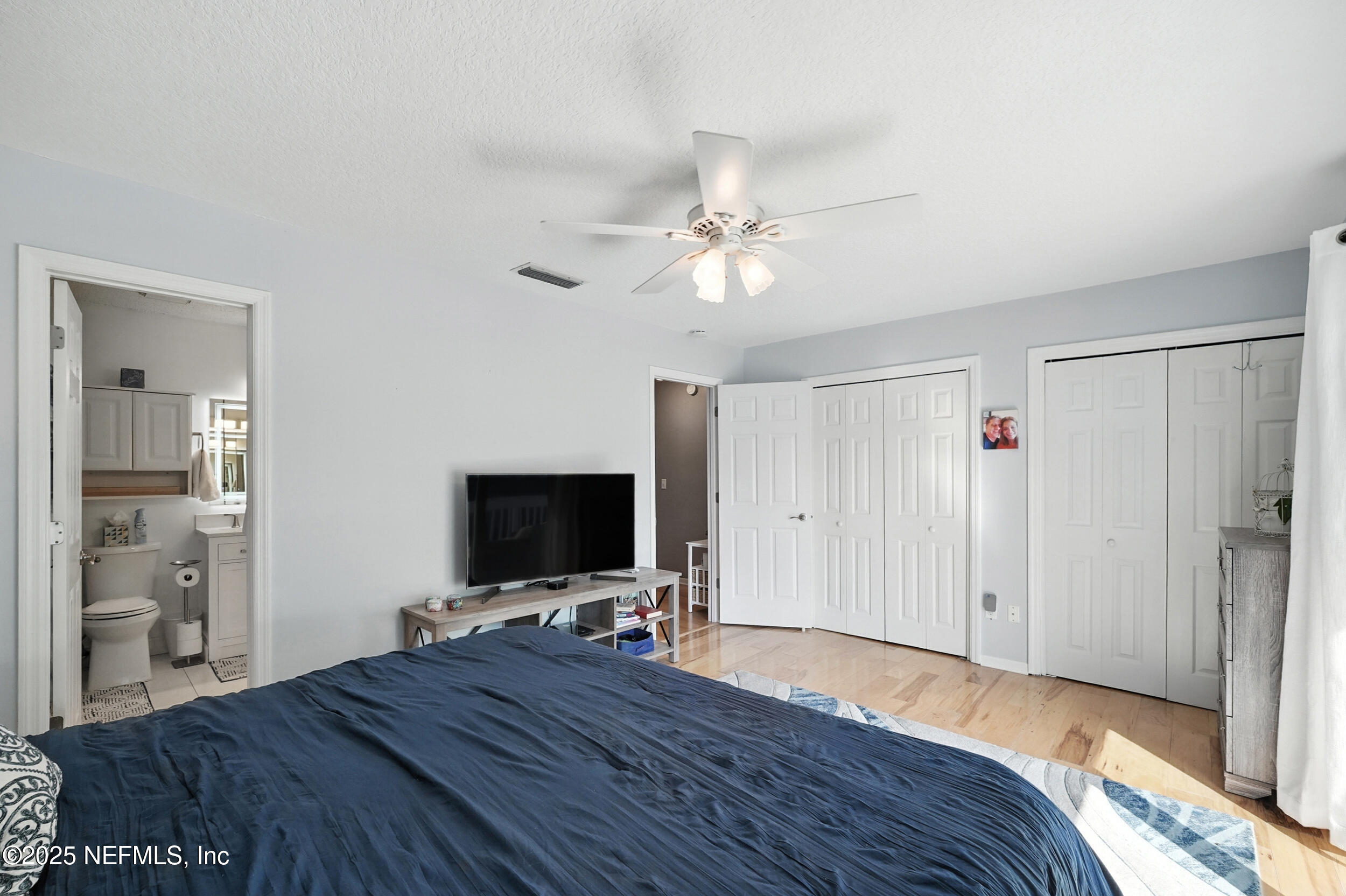 2233 Seminole Road, Unit 3 Atlantic Beach, FL 32233 - Photo 29 of 59 a bedroom with a bed and a flat screen tv