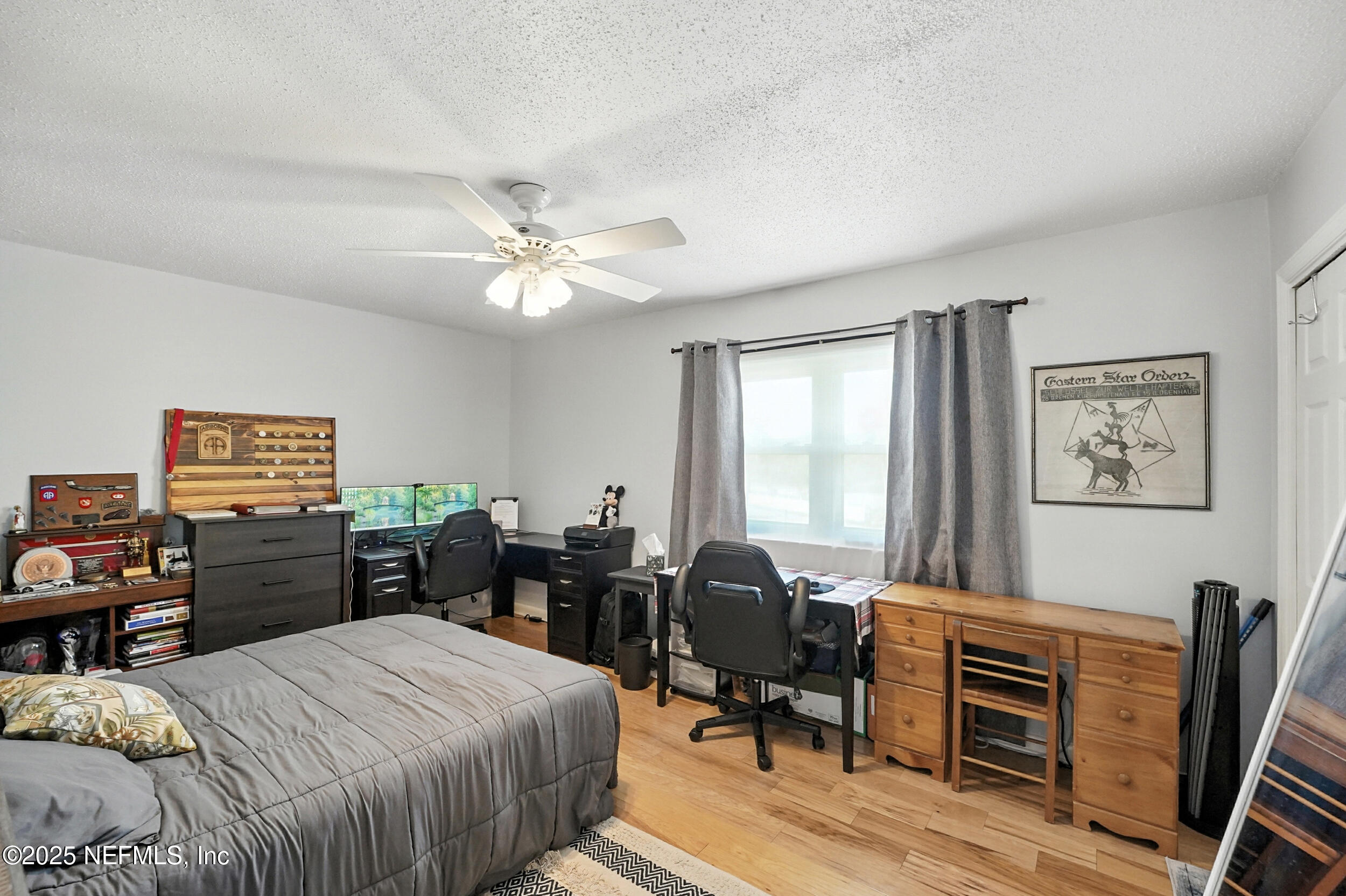 2233 Seminole Road, Unit 3 Atlantic Beach, FL 32233 - Photo 35 of 59 a bedroom with a bed and furniture with window