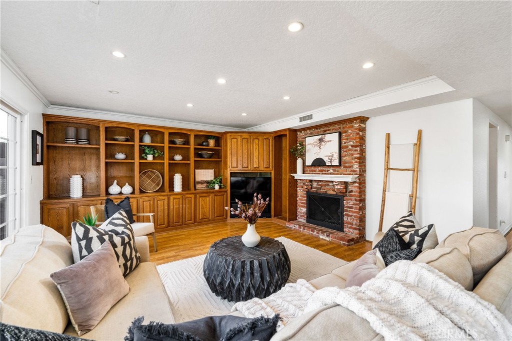 1856 Paros Circle Costa Mesa, CA 92626 - Photo 14 of 35 a bedroom with furniture a fireplace and a large window