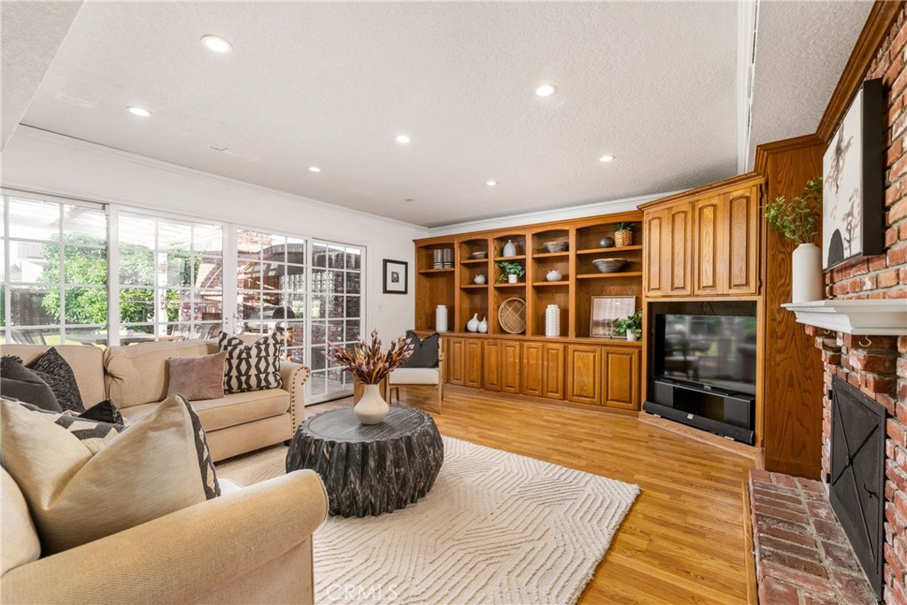 1856 Paros Circle Costa Mesa, CA 92626 - Photo 15 of 35 a living room with furniture fireplace and flat screen tv