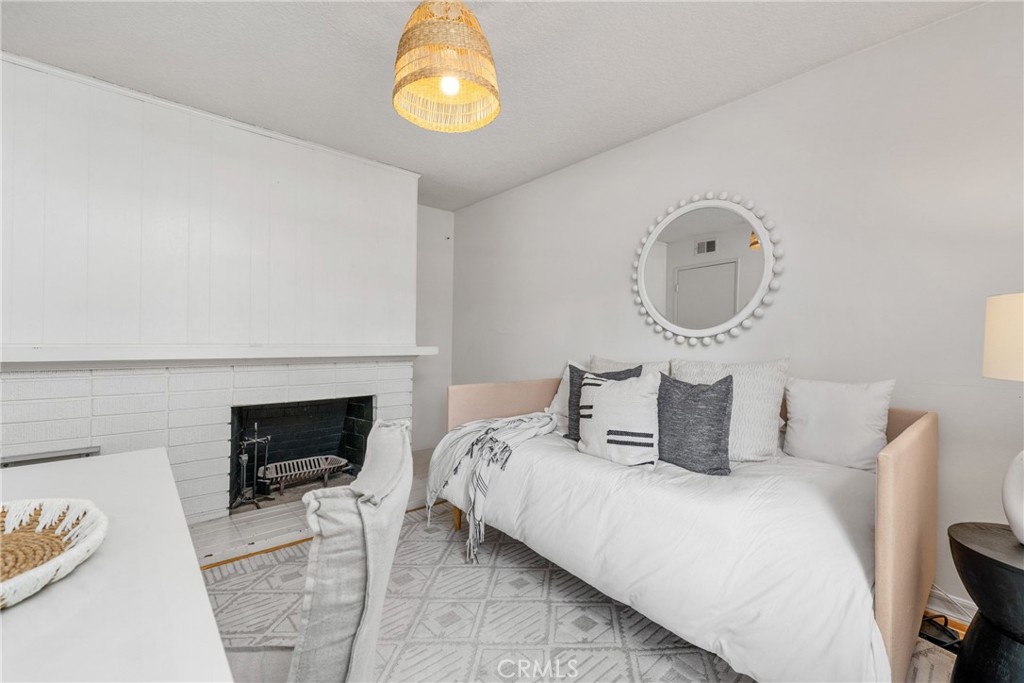 1856 Paros Circle Costa Mesa, CA 92626 - Photo 18 of 35 a bedroom with bed and a chair