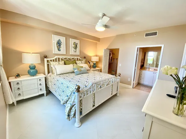 a bedroom with a bed and a couch