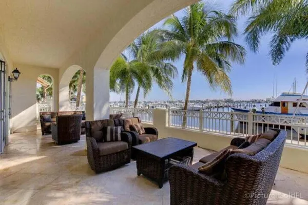a view of a swimming pool with furniture