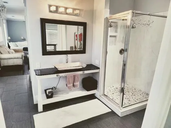 a bathroom with a sink toilet and shower