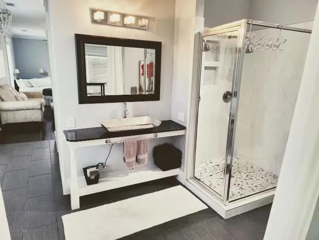 a bathroom with a sink toilet and shower