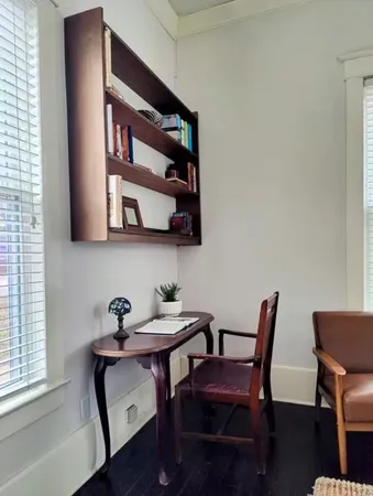 a view of a workspace with furniture