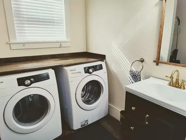 a utility room with dryer and washer