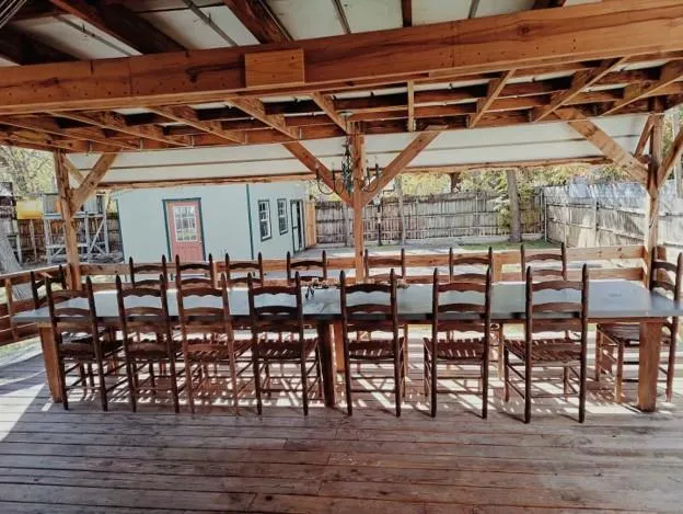 a group of chairs sitting on a roof deck