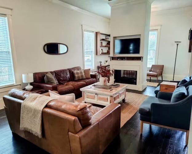 617 South 12th Street Waco, TX 76706 - Photo 4 of 28 a living room with furniture a flat screen tv and a fireplace