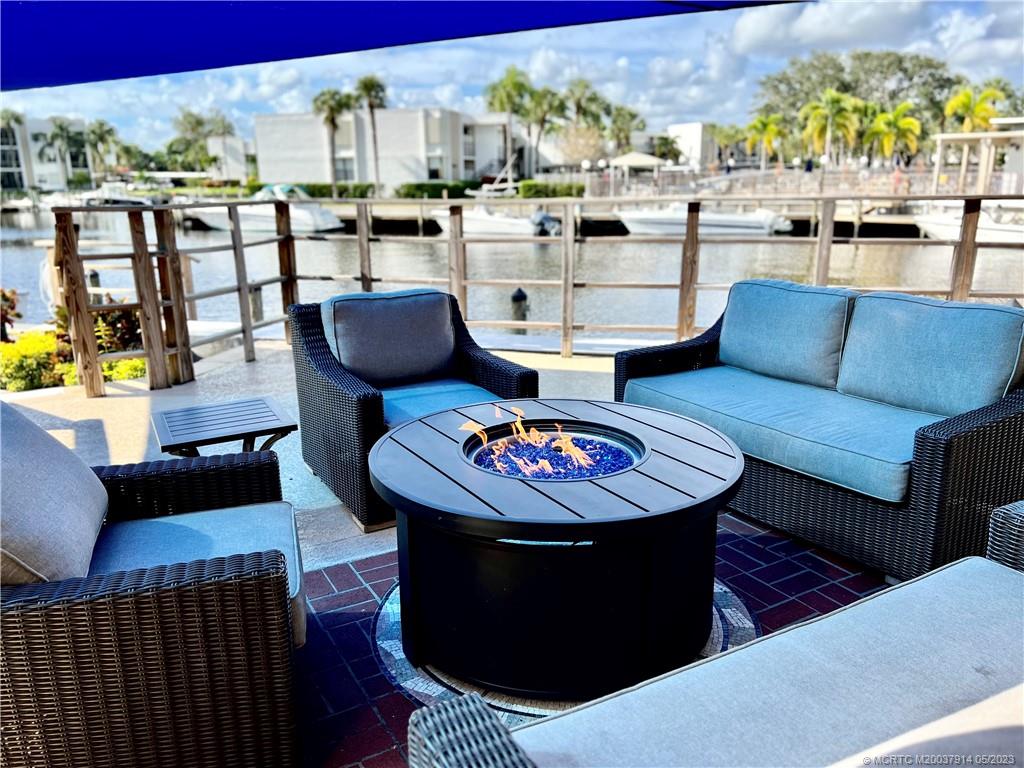 1950 Southwest Palm City Road, Unit 14207 Stuart, FL 34994 - Photo 35 of 50 Patio with fire pit for socializing.