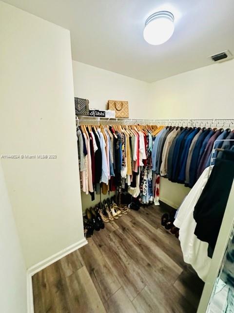 21108 Vía Eden Boca Raton, FL 33433 - Photo 29 of 48 a view of walk in closet with clothes