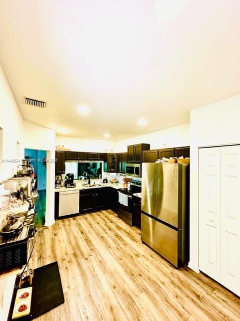 21108 Vía Eden Boca Raton, FL 33433 - Photo 30 of 48 a kitchen with a refrigerator and a stove