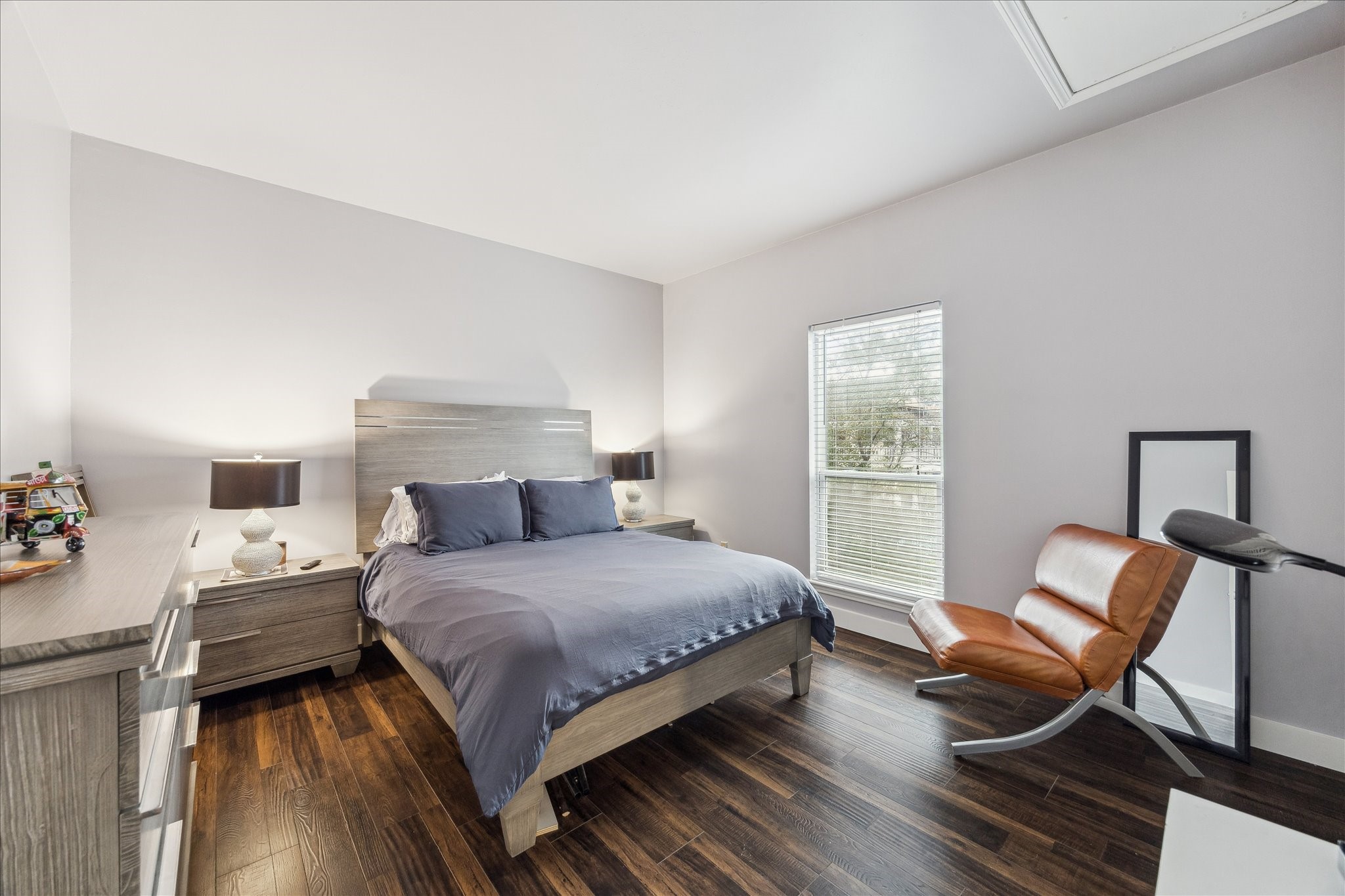 2100 Tanglewilde Street, Unit 373 Houston, TX 77063 - Photo 15 of 21 Cozy bedroom with a modern design and a large window for natural light.