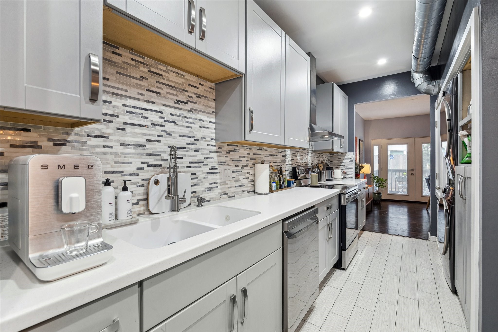 2100 Tanglewilde Street, Unit 373 Houston, TX 77063 - Photo 8 of 21 Custom cabinetry is one of the many fine details in this beautiful kitchen