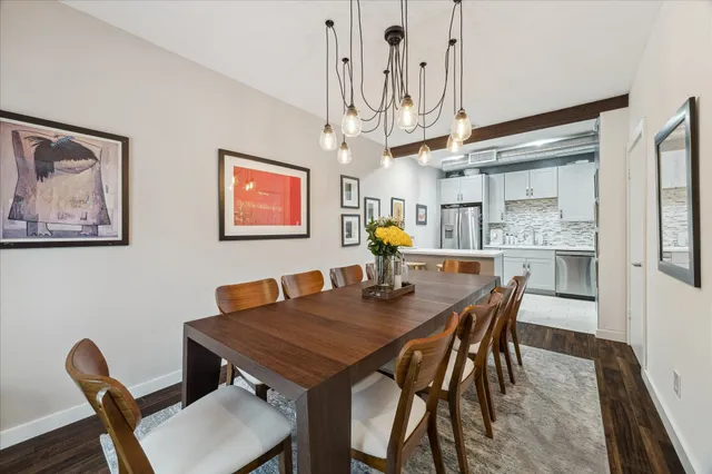 a view of a dining room with furniture and wooden floor