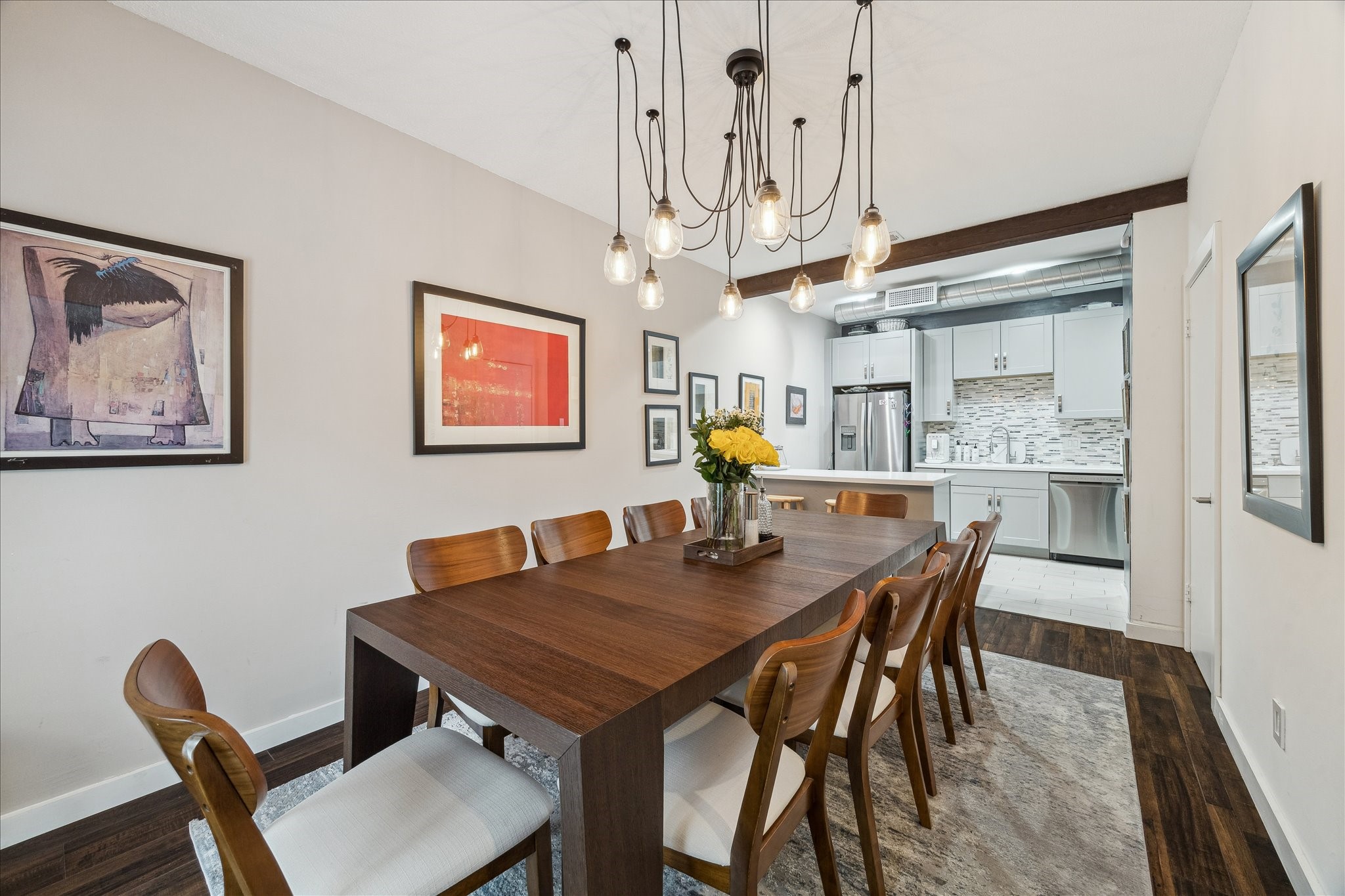 2100 Tanglewilde Street, Unit 373 Houston, TX 77063 - Photo 9 of 21 Large dining area with fabulous designer chandelier is the focal point of this room. french doors lead to a deck patio perfect for enjoying your morning coffee