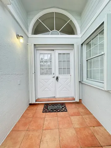 a view of an house with backyard space and garden