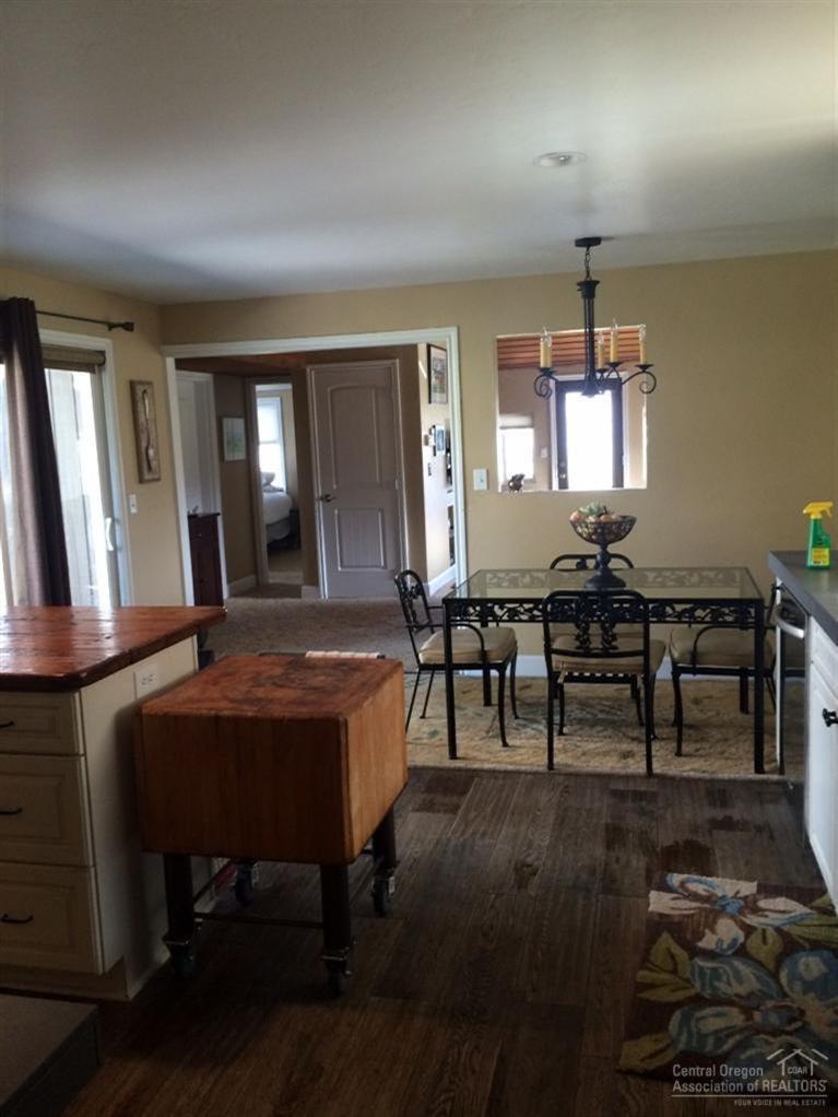 65520 Kentucky Road Bend, OR 97703 - Photo 13 of 25 a view of a dining room with furniture and window
