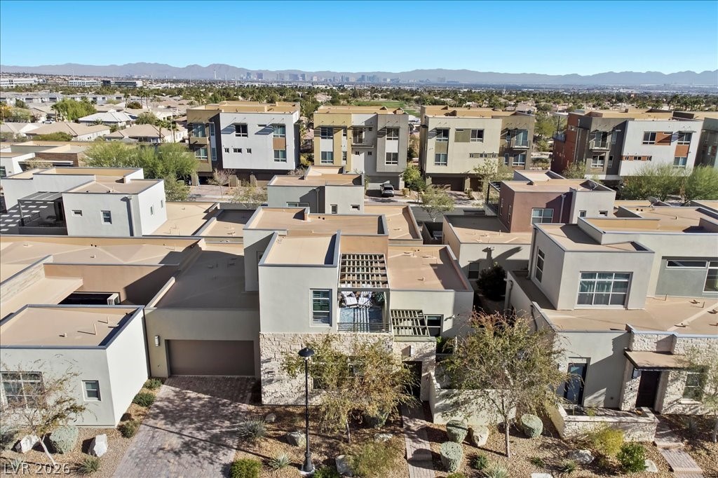 4262 Swift Street Las Vegas, NV 89135 - Photo 52 of 75 Aerial view of residential area with a mountain backdrop