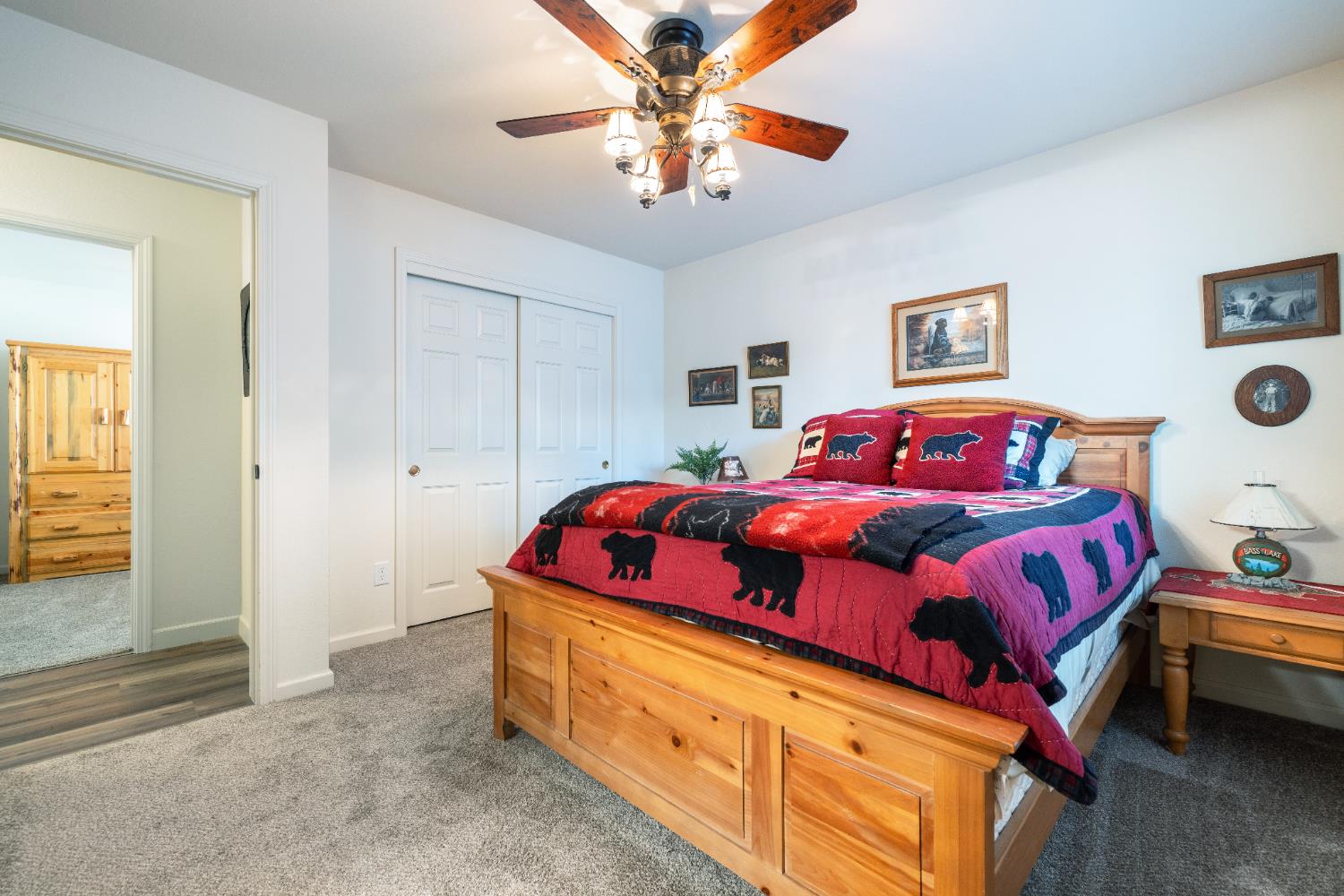 39398 Robin Bass Lake, CA 93604 - Photo 18 of 31 a bedroom with a bed and a chandelier