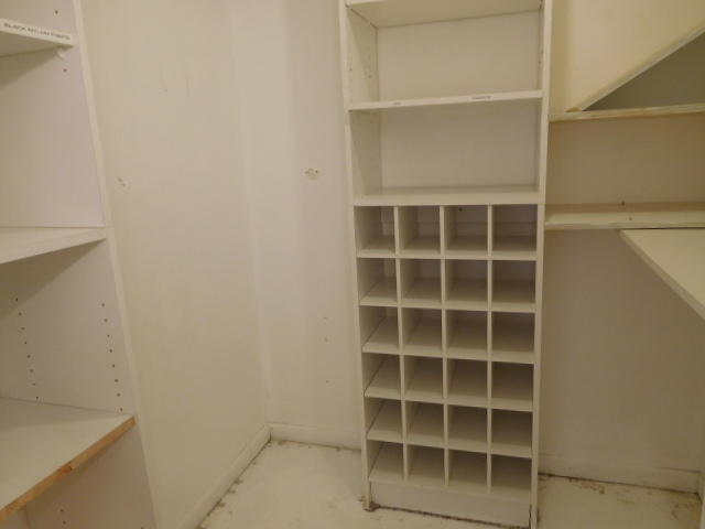 11504 Whisper Sound Drive Boca Raton, FL 33428 - Photo 14 of 32 a view of an empty room with empty racks