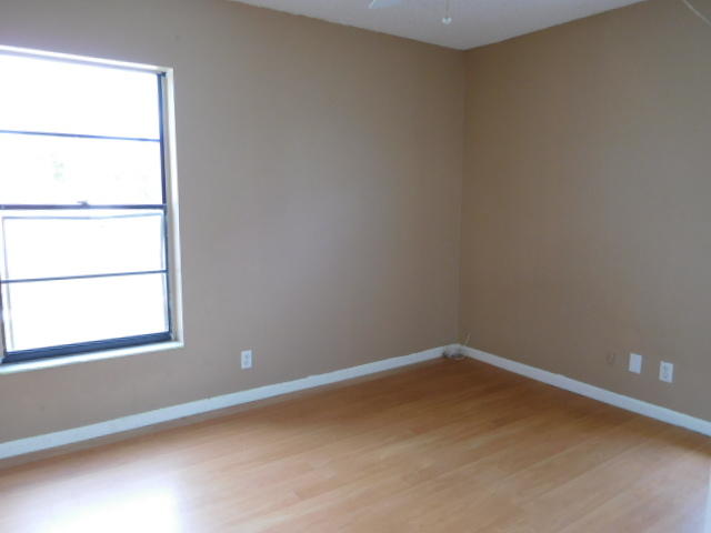 11504 Whisper Sound Drive Boca Raton, FL 33428 - Photo 21 of 32 an empty room with a window