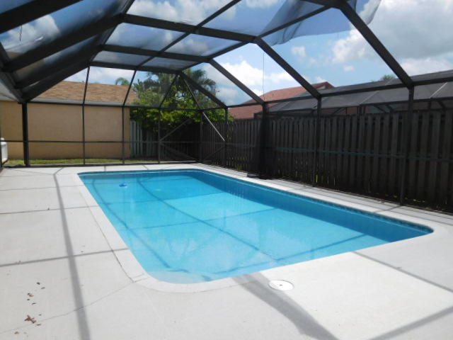 11504 Whisper Sound Drive Boca Raton, FL 33428 - Photo 27 of 32 a view of backyard with a small cabin