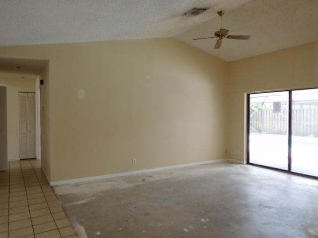 11504 Whisper Sound Drive Boca Raton, FL 33428 - Photo 30 of 32 a view of an empty room and a window