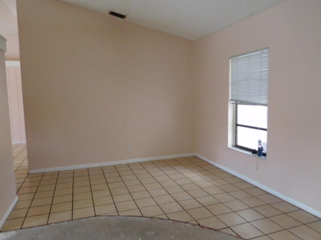 11504 Whisper Sound Drive Boca Raton, FL 33428 - Photo 3 of 32 a view of an empty room and window