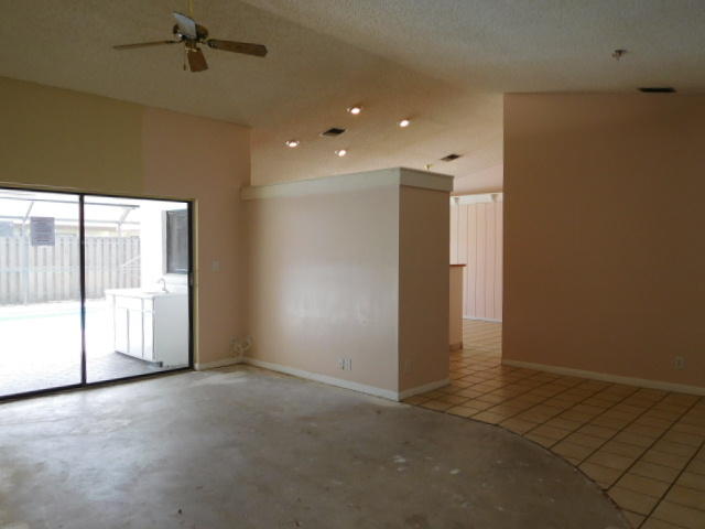 11504 Whisper Sound Drive Boca Raton, FL 33428 - Photo 31 of 32 a view of an empty room with a window