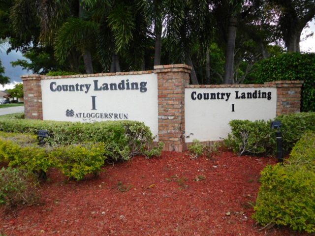 11504 Whisper Sound Drive Boca Raton, FL 33428 - Photo 32 of 32 a sign on the side of a road