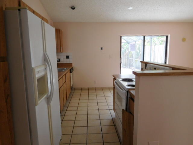 11504 Whisper Sound Drive Boca Raton, FL 33428 - Photo 7 of 32 a view of a kitchen with a sink
