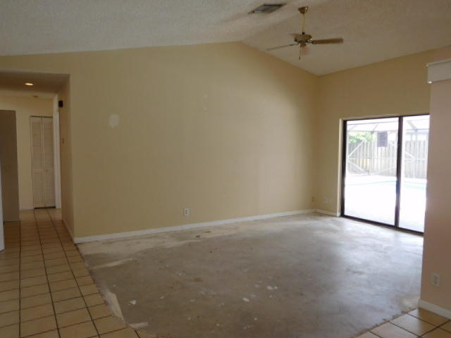 11504 Whisper Sound Drive Boca Raton, FL 33428 - Photo 9 of 32 wooden floor in an empty room with a window