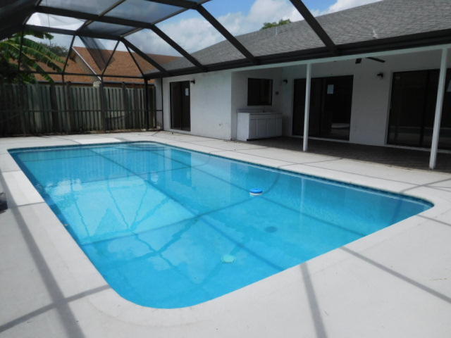 11504 Whisper Sound Drive Boca Raton, FL 33428 - Photo 10 of 32 a view of a backyard