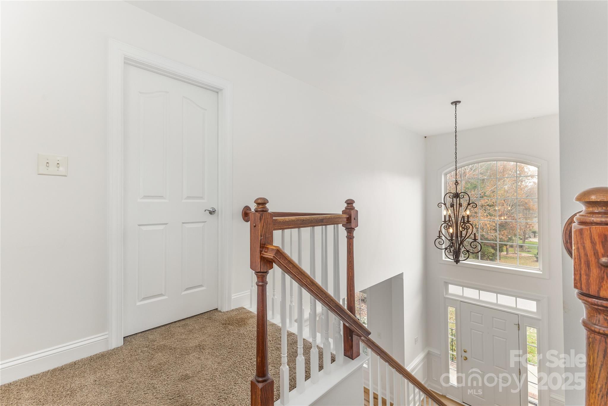 884 Clonmel Drive Matthews, NC 28104 - Photo 18 of 48 a view of a hallway with wooden floor and stairs