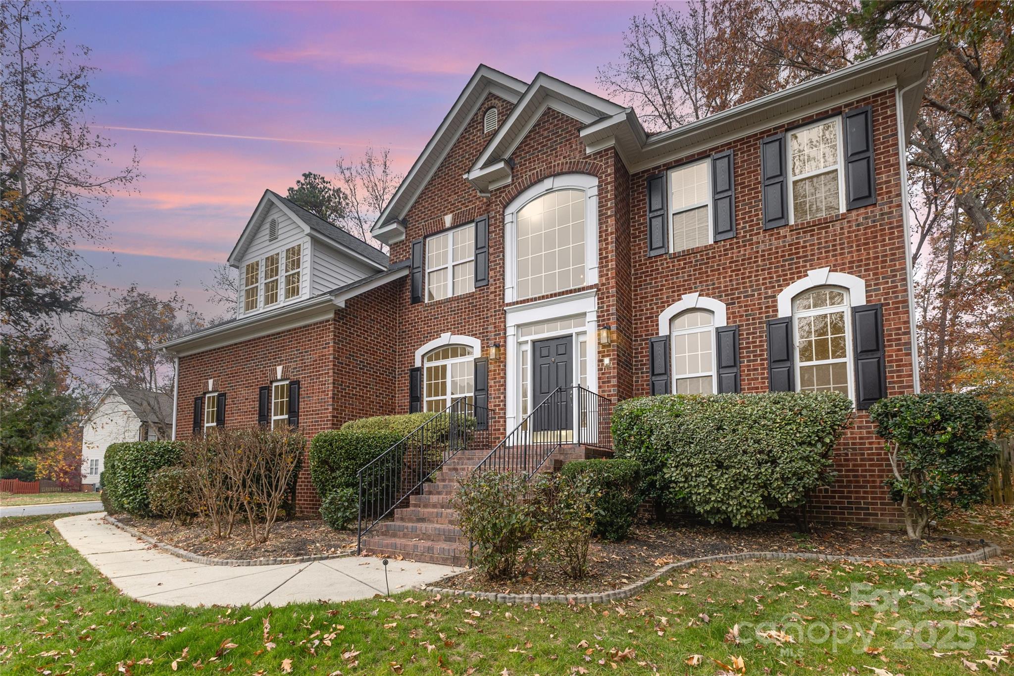 884 Clonmel Drive Matthews, NC 28104 - Photo 2 of 48 a front view of a house with a yard