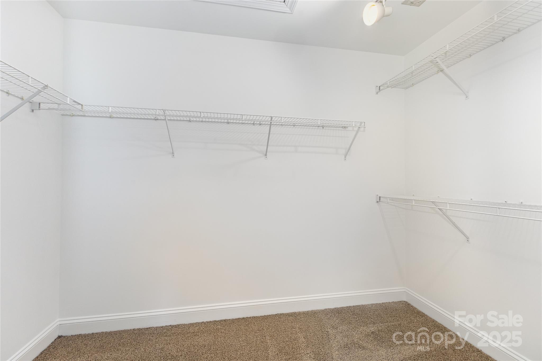 884 Clonmel Drive Matthews, NC 28104 - Photo 24 of 48 a view of a room with racks on the wall