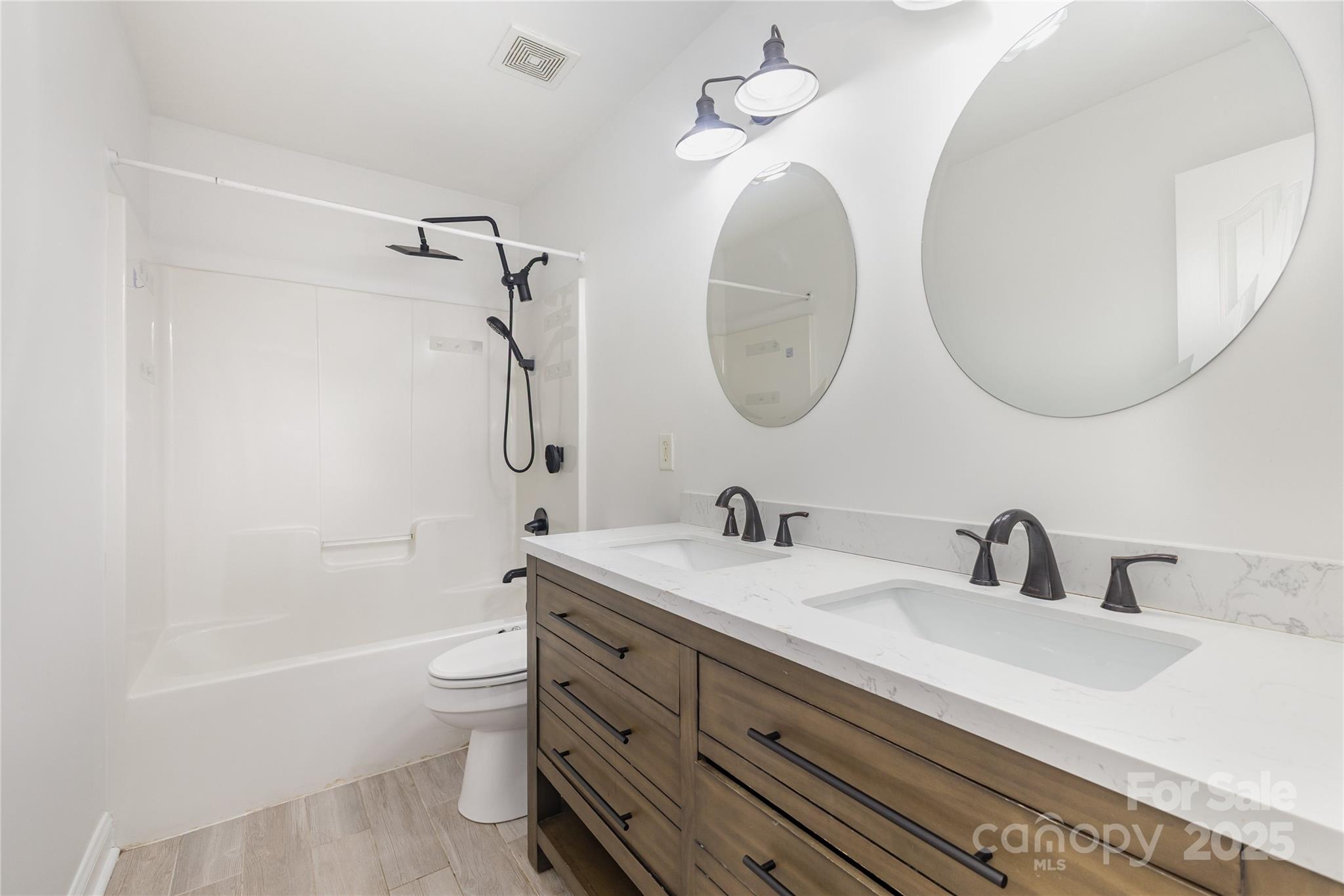 884 Clonmel Drive Matthews, NC 28104 - Photo 31 of 48 a bathroom with a sink a toilet and a mirror