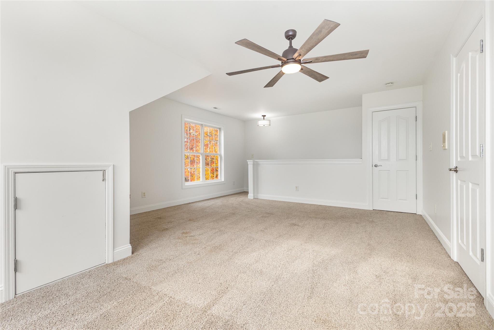 884 Clonmel Drive Matthews, NC 28104 - Photo 33 of 48 an empty room with window and ceiling fan