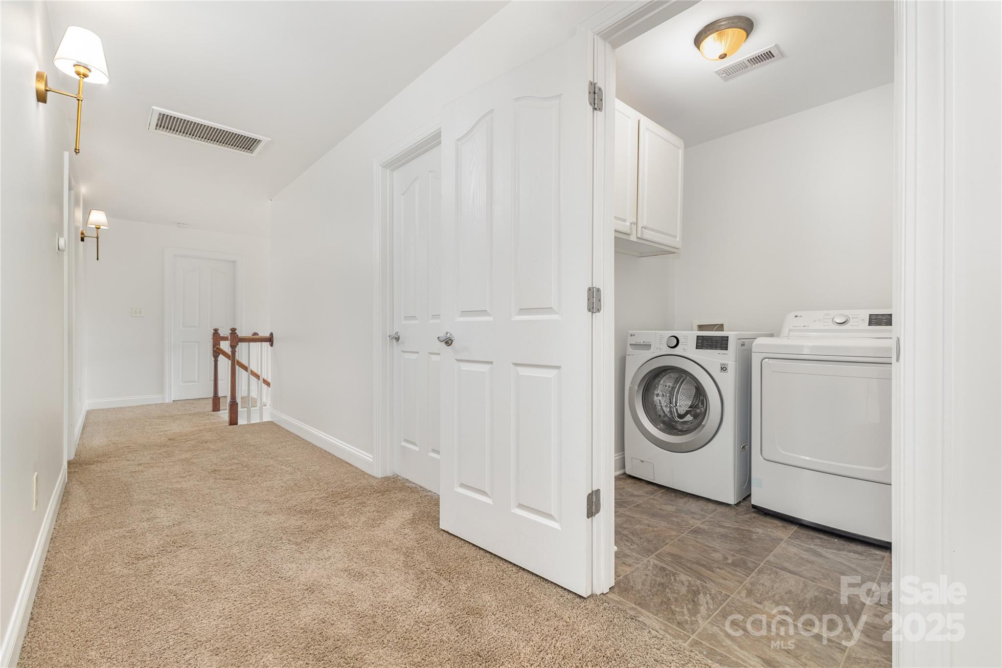 884 Clonmel Drive Matthews, NC 28104 - Photo 34 of 48 a view of a storage and utility room with washer and dryer