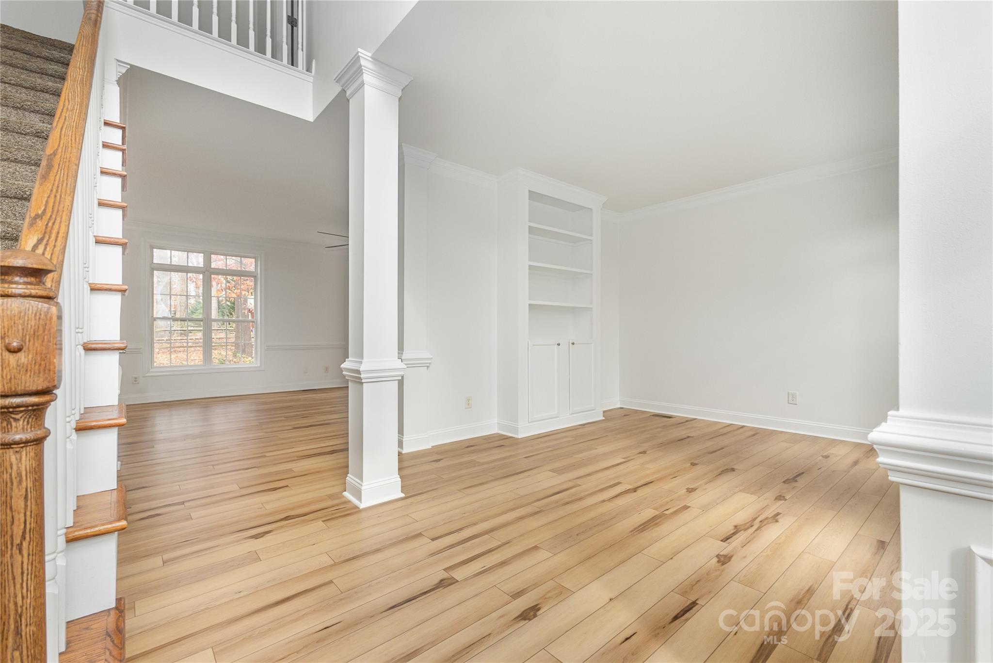 884 Clonmel Drive Matthews, NC 28104 - Photo 4 of 48 a view of empty room with wooden floor and fan