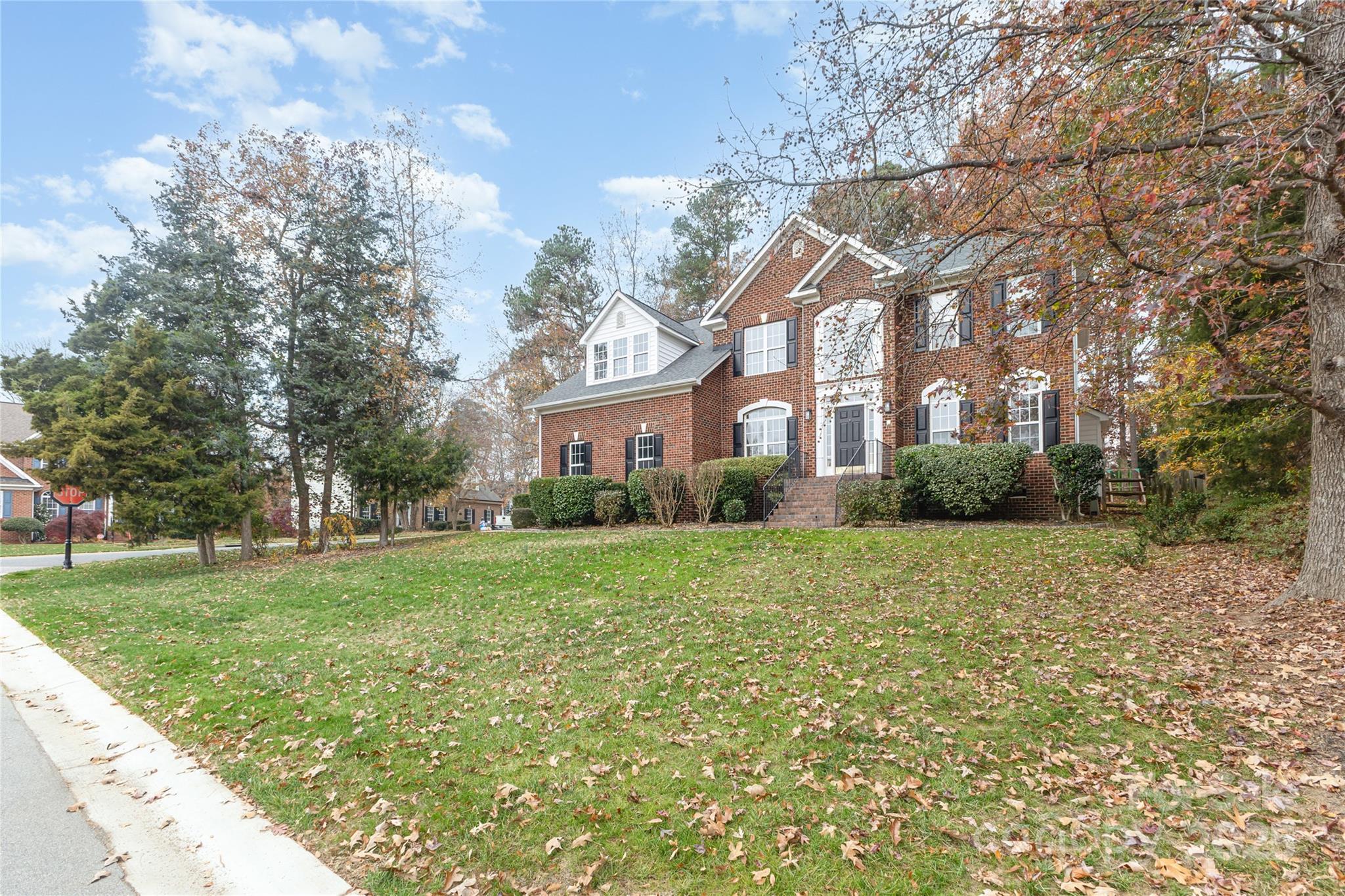 884 Clonmel Drive Matthews, NC 28104 - Photo 46 of 48 a front view of a house with a yard