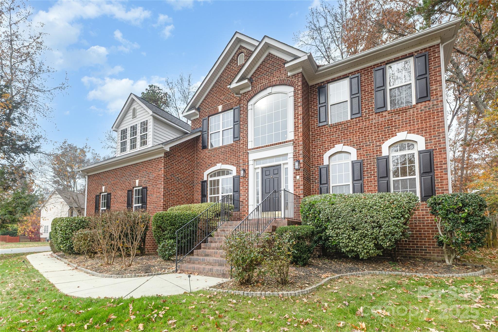 884 Clonmel Drive Matthews, NC 28104 - Photo 47 of 48 a front view of a house with a yard